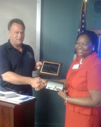 Cynthia Elliott receives the Key to the City of Prestonsburg, Ky., from Mayor Jerry Fannin.