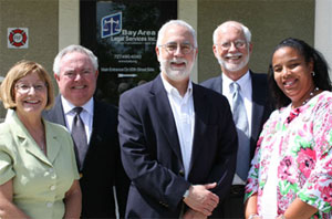 LSC President Victor M. Fortuno, center, with Bay Area Legal Services staff: (from left to right) Joan Boles, Deputy Director; J.P. LaCasse, Chief Operating Officer; Dick Woltman, Executive Director; Lisa L. Brody, Managing Attorney of the new St. Petersburg office.