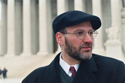 Douglas Gershuny, new Executive Director of South Jersey Legal Services, standing in front of the U.S. Supreme Court.