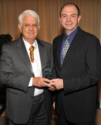 Ralph Livingstone, left, receives his award from Charles Pettigrew of the MetLife Foundation.