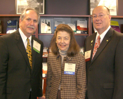 LSC President Helaine M. Barnett stands with Laurence M. Rose (left), President and CEO of NITA, and Mark Caldwell, Director of Specialty Programs for NITA.