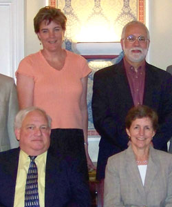 Standing: Victoria A. Coyle, executive director of North Penn Legal Services, and Victor M. Fortuno, president of LSC. Sitting: Harvey F. Strauss and Elizabeth Fritsch, co-executive directors of Legal Aid of Southeastern Pennsylvania.