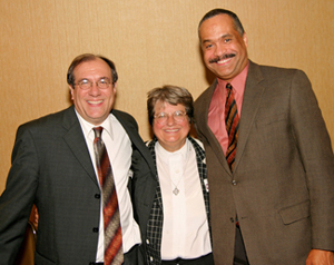 Sister Helen Prejean stands with Daniel K. Glazier, LSEM Executive Director and General Counsel, left, and Reuben Shelton, President of LSEM's Board of Directors.