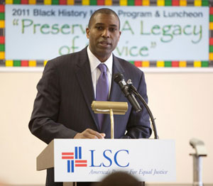 Above: Assistant Attorney General Tony West speaks at LSC’s Black History Observance. Below: West stands with LSC President James J. Sandman (left) and LSC Board Chairman John G. Levi. Photos by Dakota Fine.
