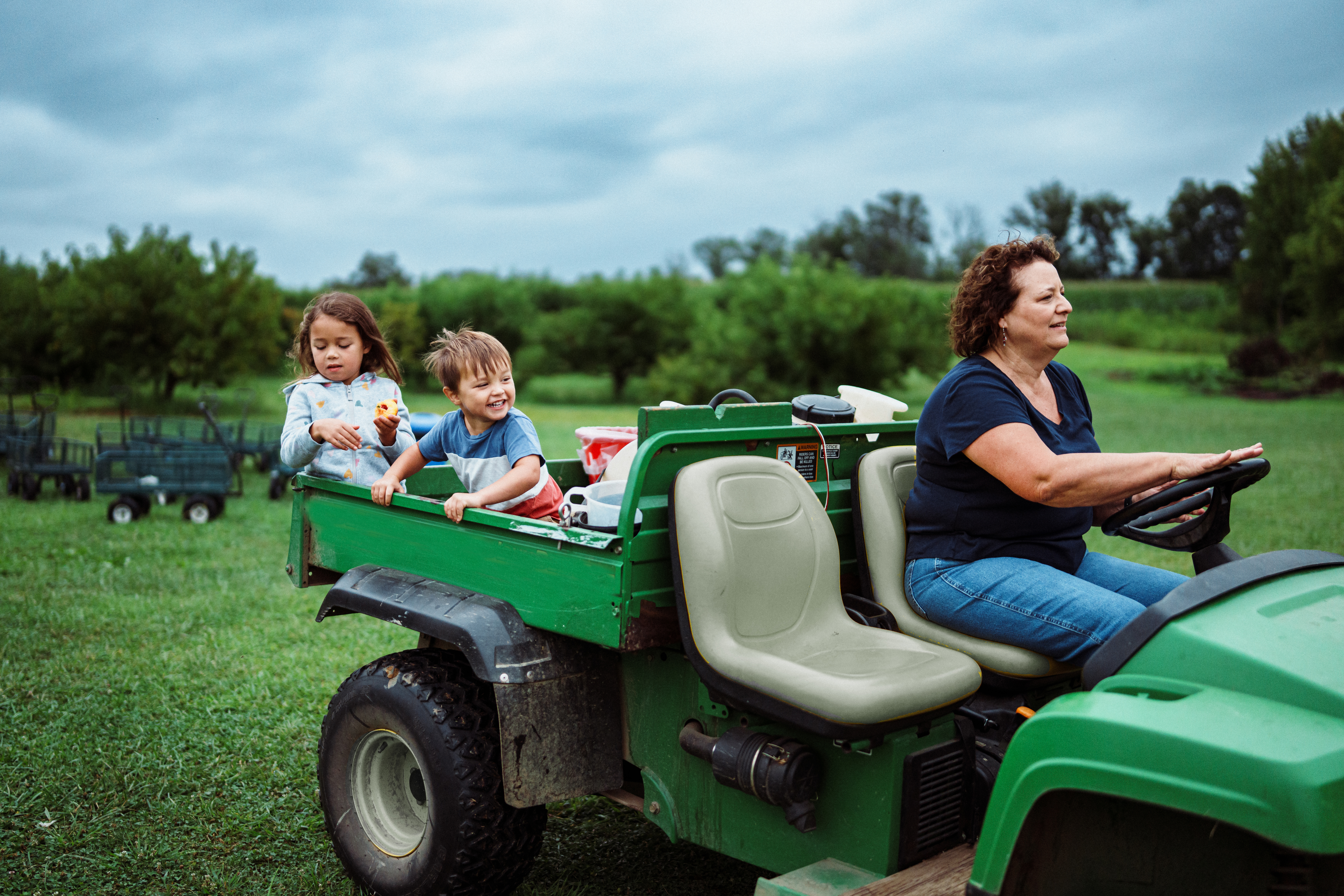 rural family riding a tractor