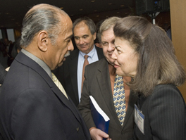 LSC President Helaine M. Barnett speaks with Rep. Conyers. Picture Copyright American Bar Association.