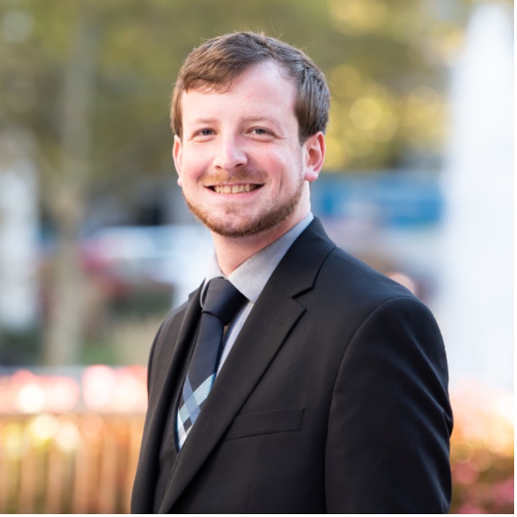 Man in suit outside photo