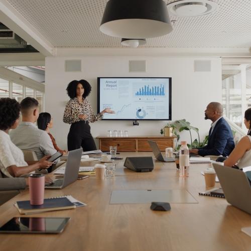 Staff presenting data in a meeting.