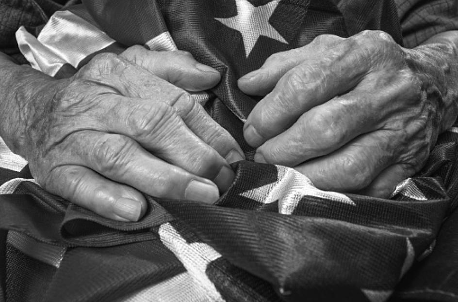 veteran holding american flag