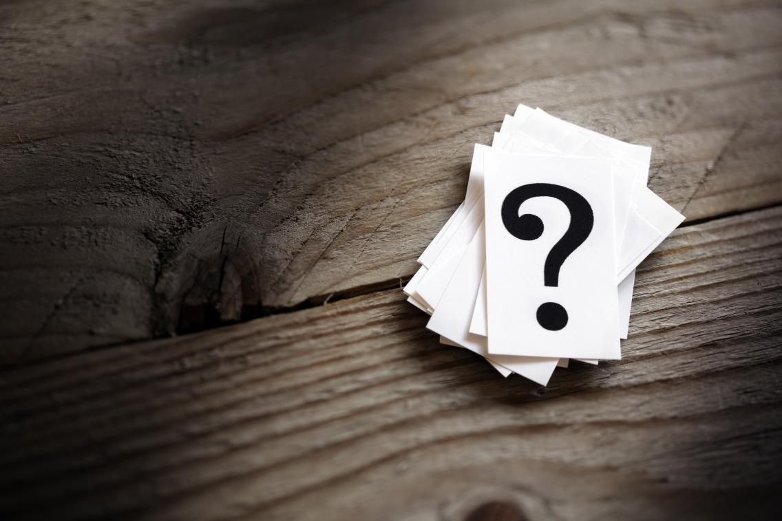 shutterstock_question_mark_on_table