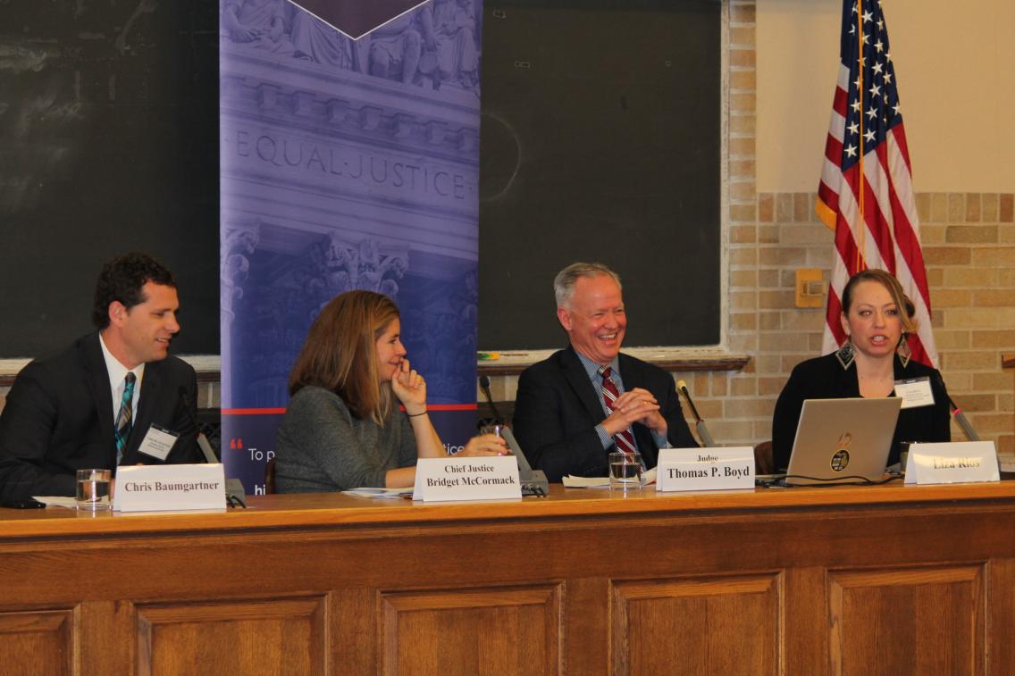 Group of people at table during a panel