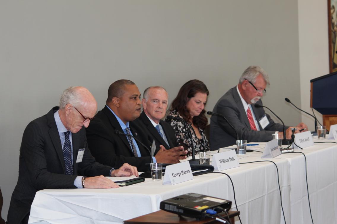 Group of people at table during a panel