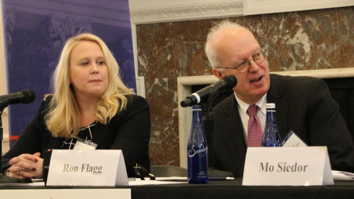 Group of people at table during a panel