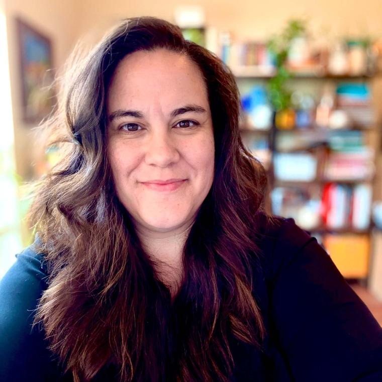 Image of woman smiling into the camera
