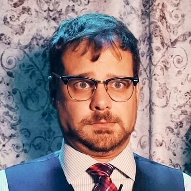 Headshot of man with glasses