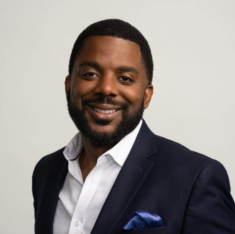 Headshot of man smiling to the camera